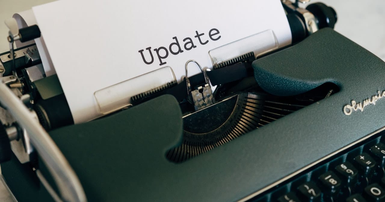 A typewriter with the word update on a piece of paper