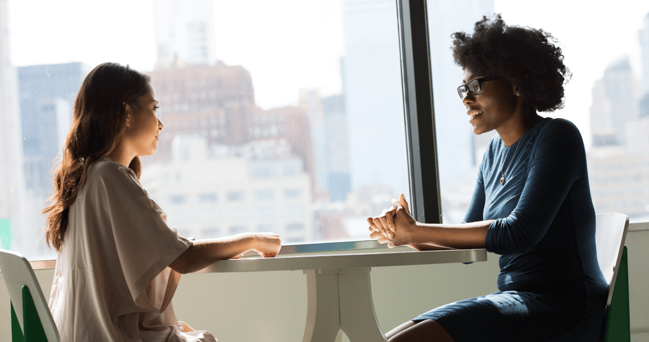 two people having a one to one discussion at work