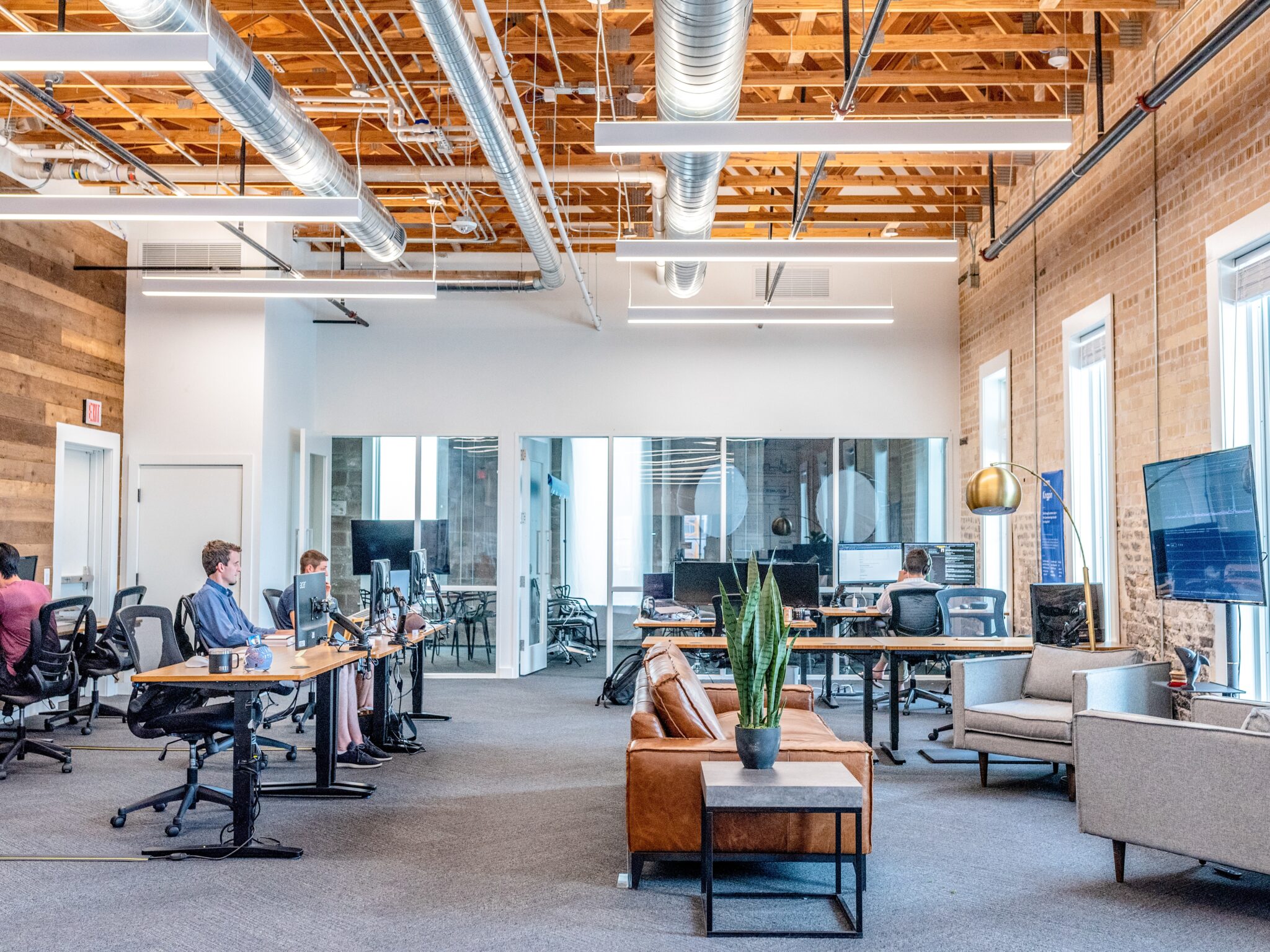 Open-plan office with desks and sofa seating