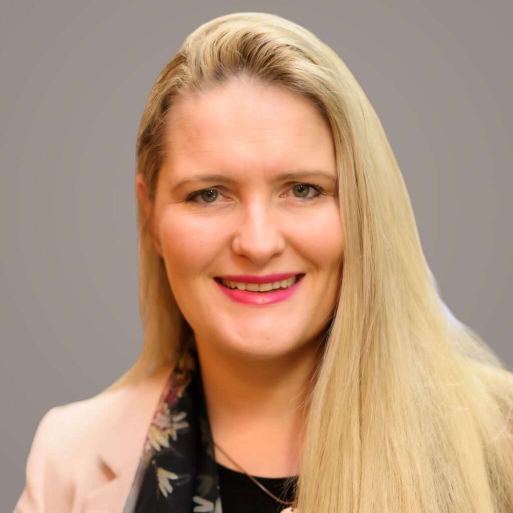 A profile picture of Katie White against a grey background