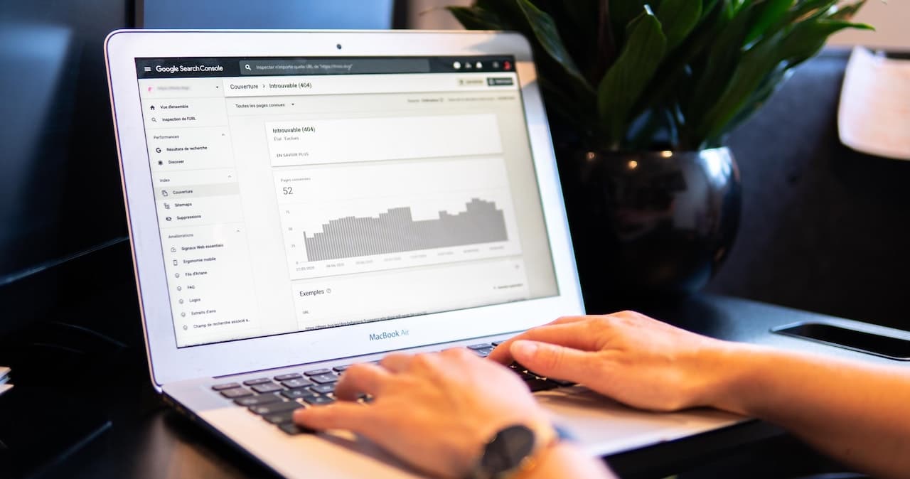 A person using Google Analytics on their laptop
