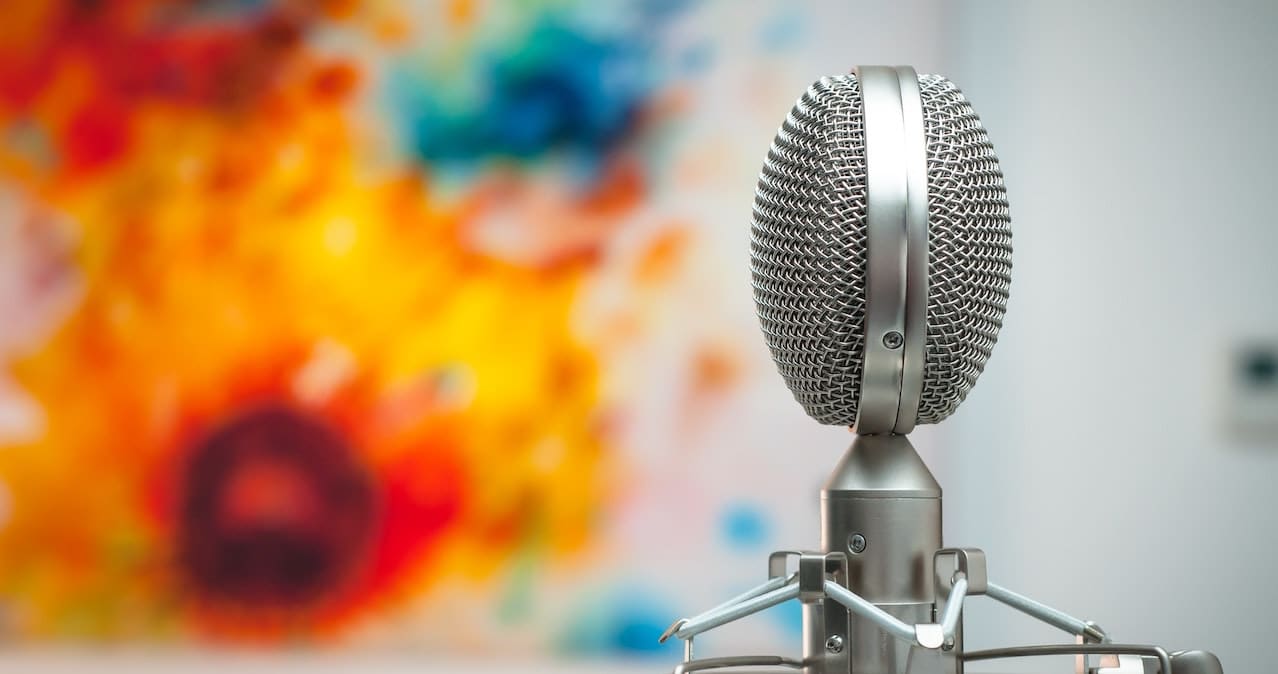 A grey microphone in an empty room