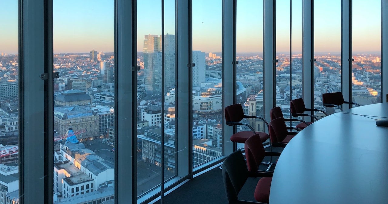 An empty office in a corporate workplace, overlooking a city landscape