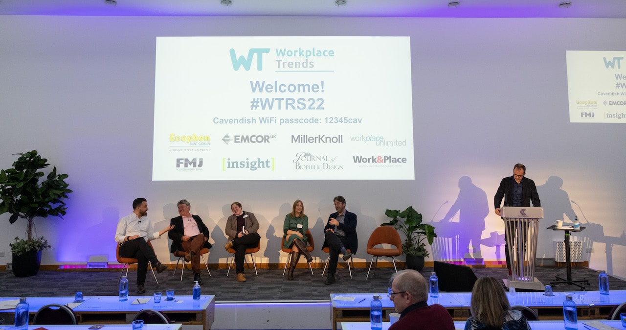 Six people on stage at the Workplace Trends Research Summit 2022