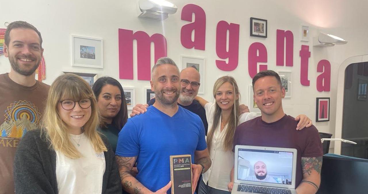 Magenta Associates employees pose with the trophy for best use of PR from the Property Marketing Awards 2022