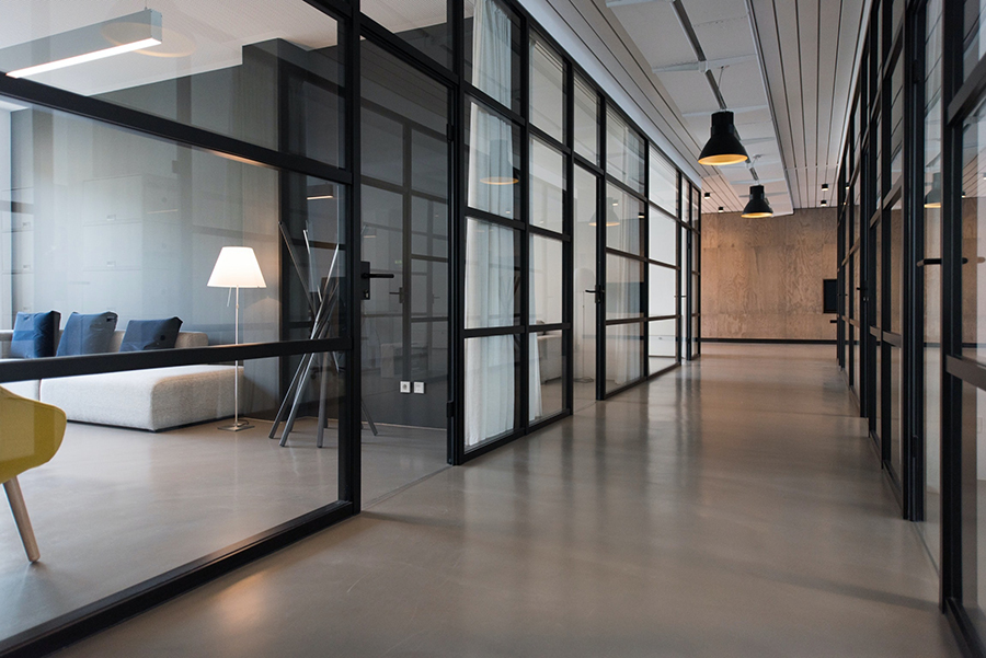 An open plan office interior with glass walls