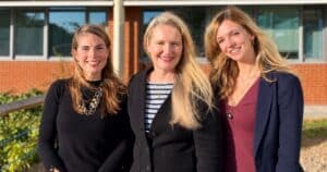 Cathy Hayward, Katie White and Jo Sutherland standing side by side in front of a building